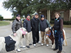 The HPD Training Academy team - Chad Curtis, Brett Cross, Eddie Diaz, and Diana Poor pose with SIRE minis Gracie and Scarlet.
